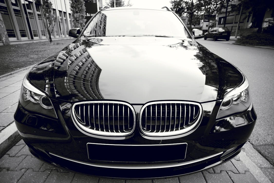 Silver BMW car parked on a city street