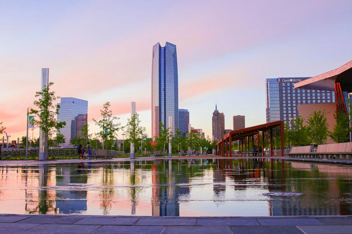Body of water near high-rise buildings during daytime in Oklahoma City, Oklahoma