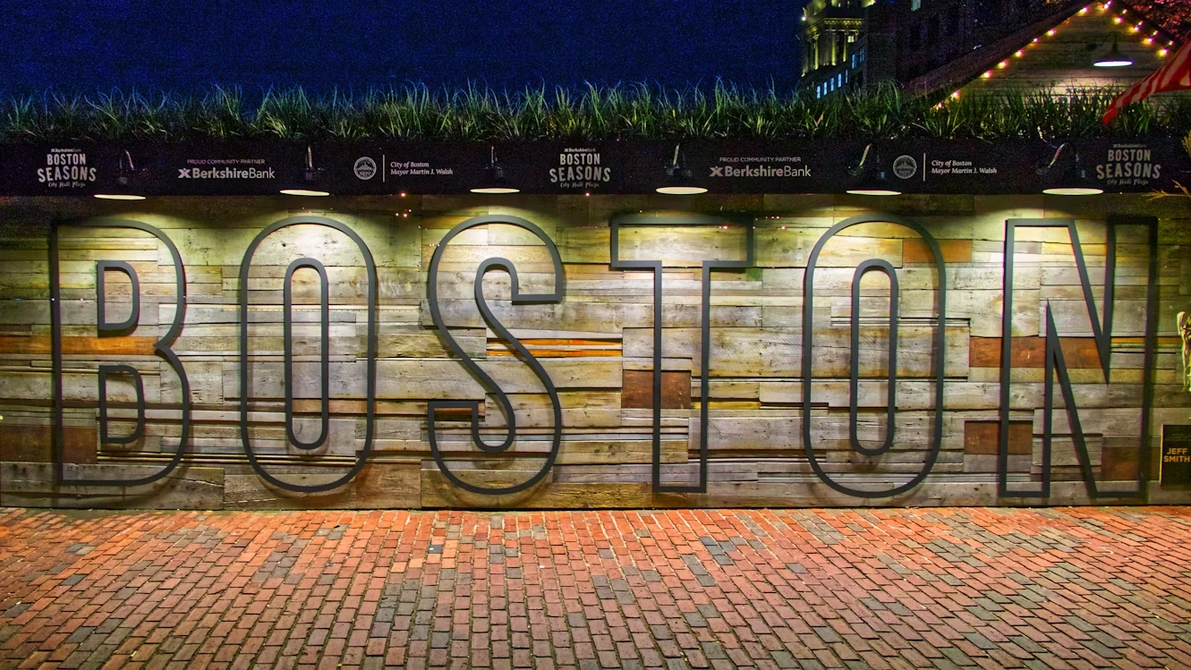 Boston street art sign saying “Boston” with skyline elements
