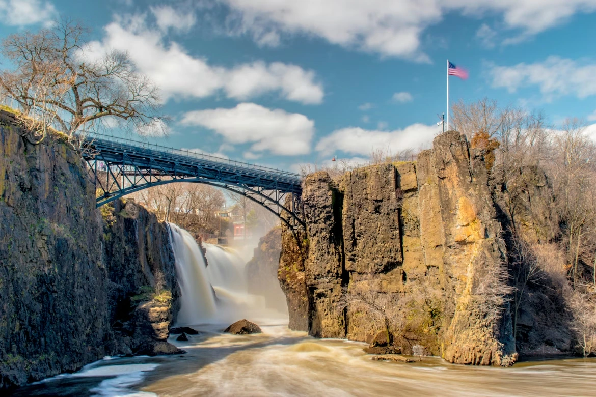 Bridge over a river near a waterfall at Great Falls Park in Paterson, New Jersey