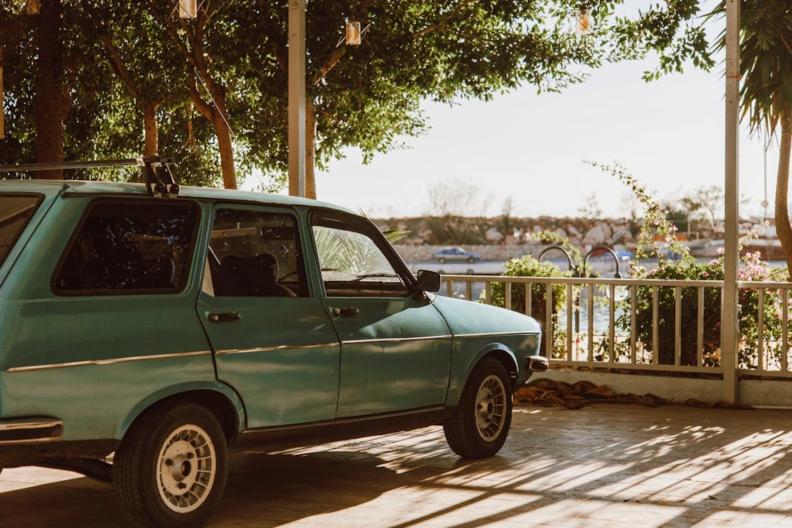 Classic teal car on a summer day