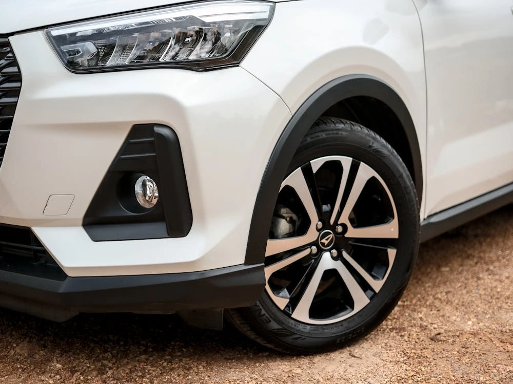 Close-up of modern white car’s front exterior