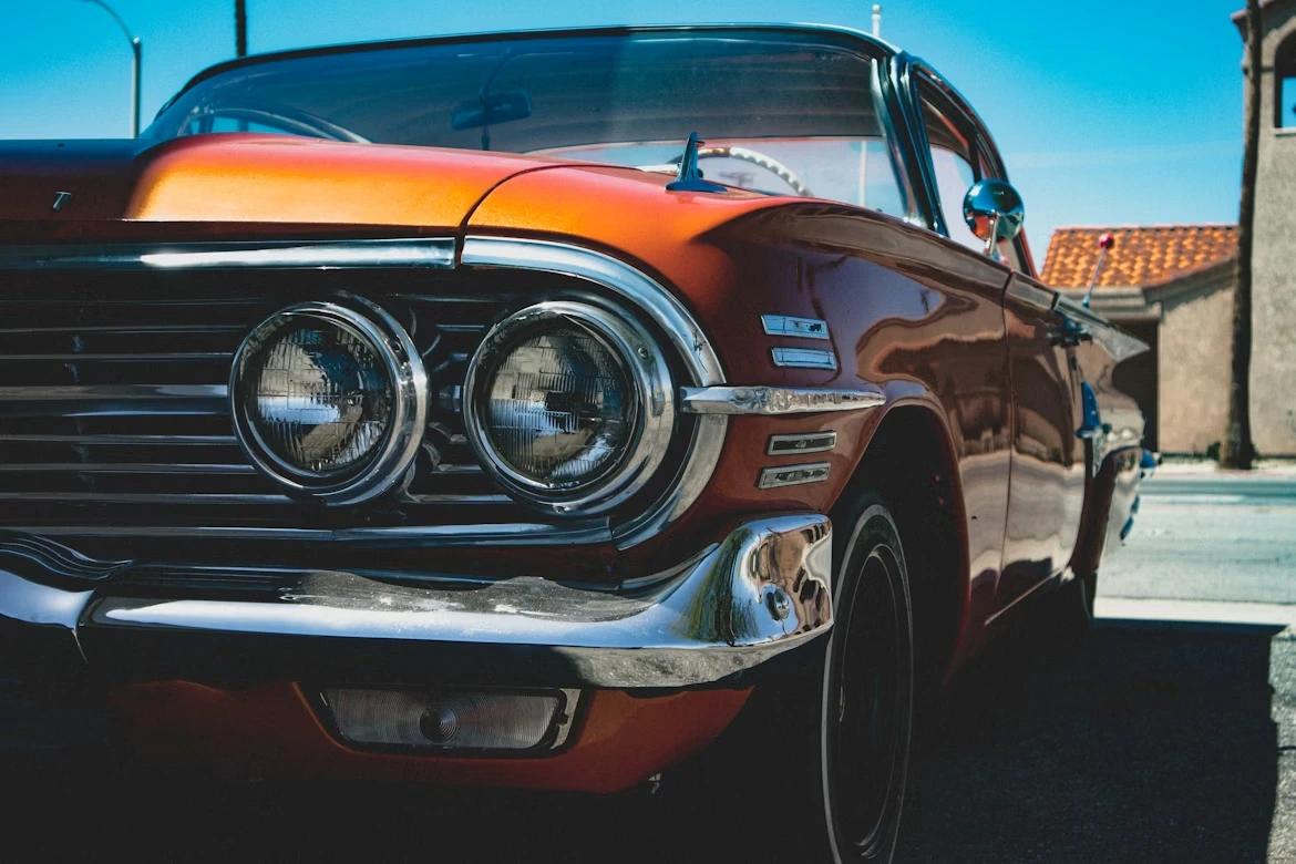 Orange and silver car in a parking lot