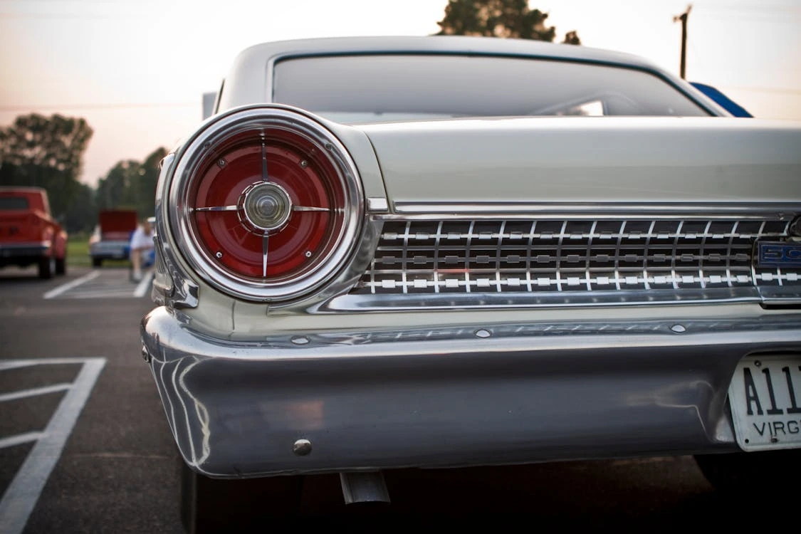 Classic Ford car parked in a parking lot