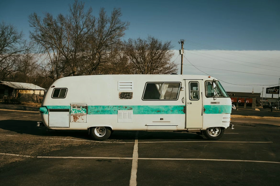 White and green vintage bus parked