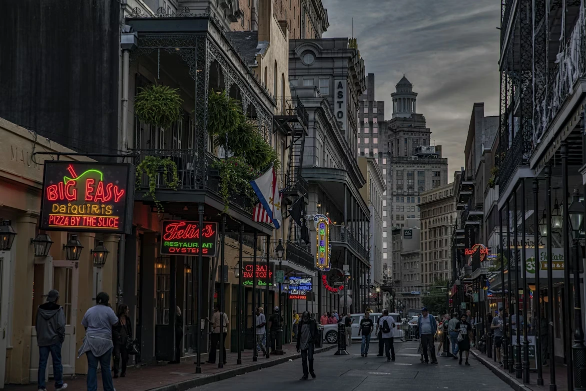People walking on busy city streets during daytime in New Orleans, LA