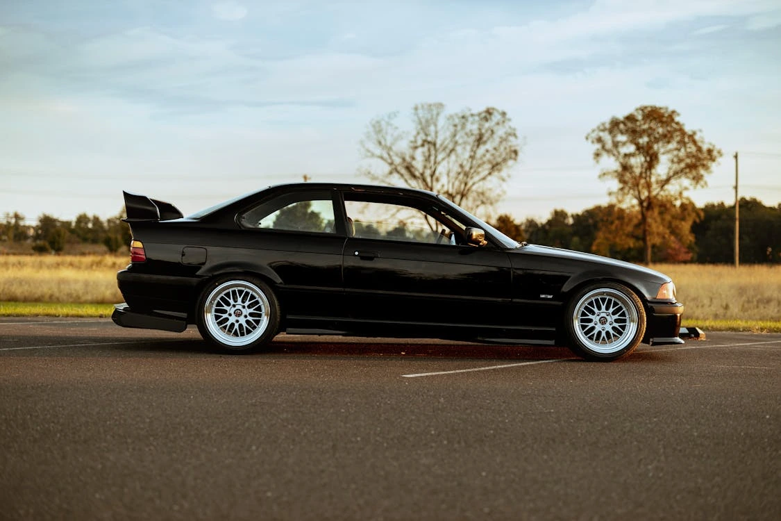 Photo of a black car parked outdoors