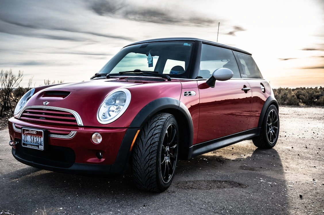 Photo of a red Mini Cooper parked on a road