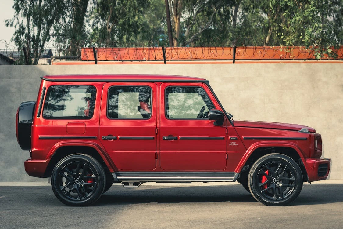 Red Mercedes-Benz G-Class SUV parked outdoors