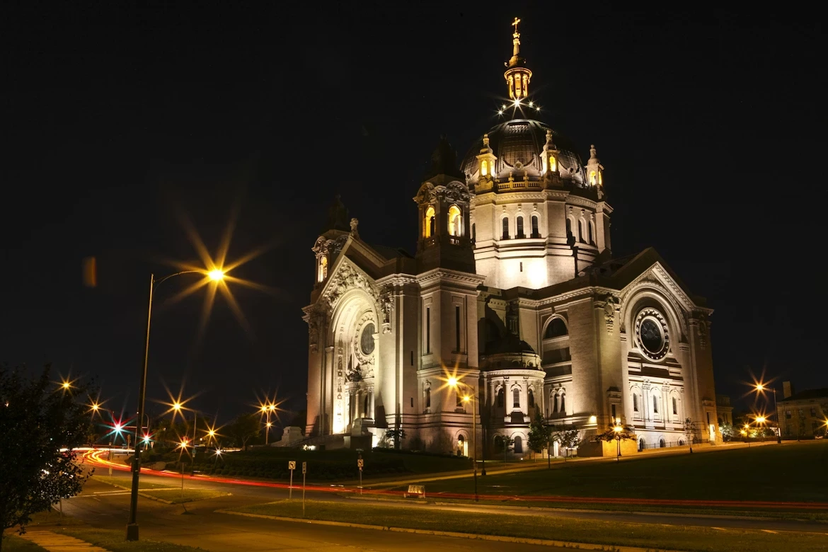 White and brown concrete building at night at the Cathedral of Saint Paul in Saint Paul, Minnesota