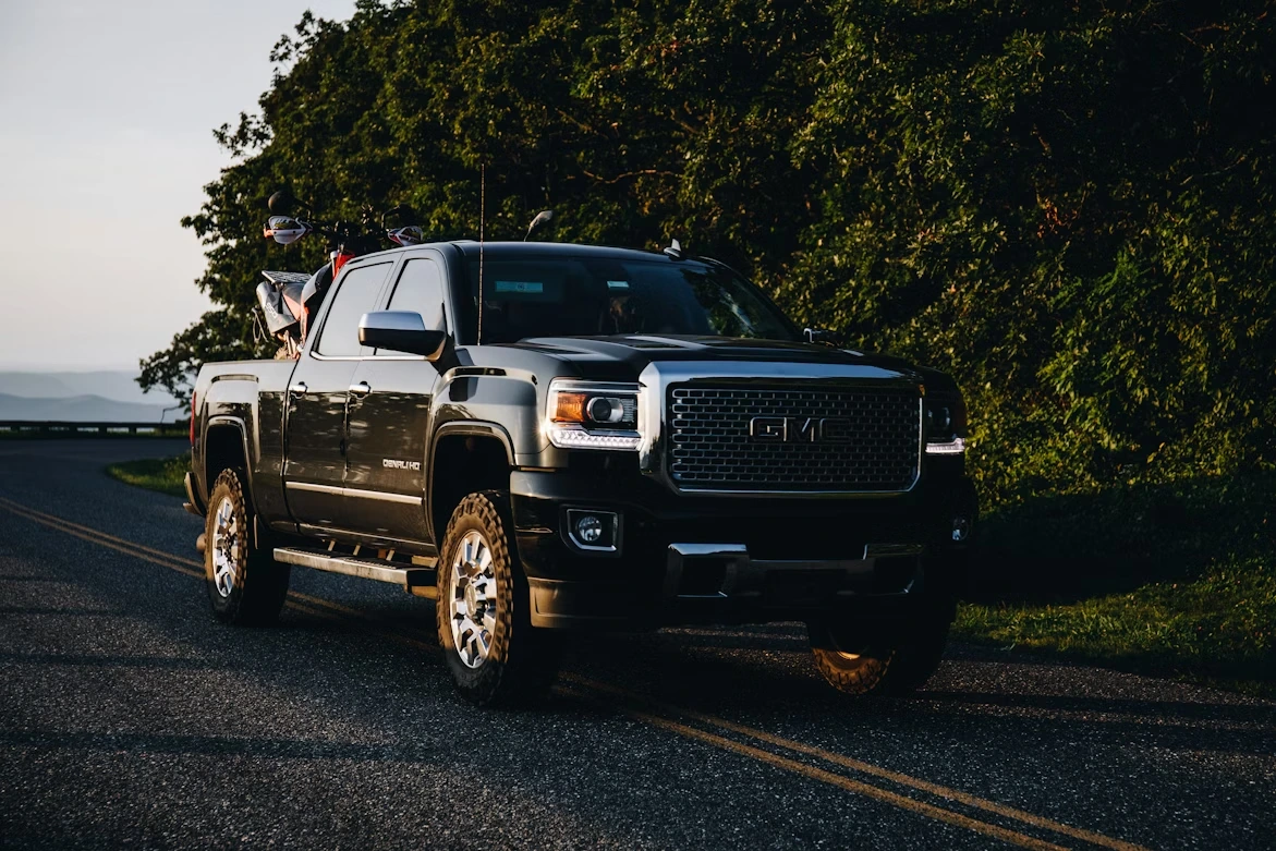 White Chevrolet Crew Cab pickup truck on a road during daytime