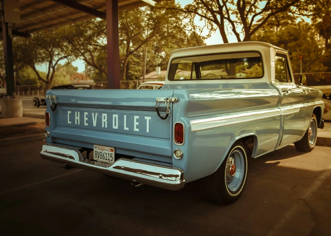 White Chevrolet single-cab pickup truck parked on a road