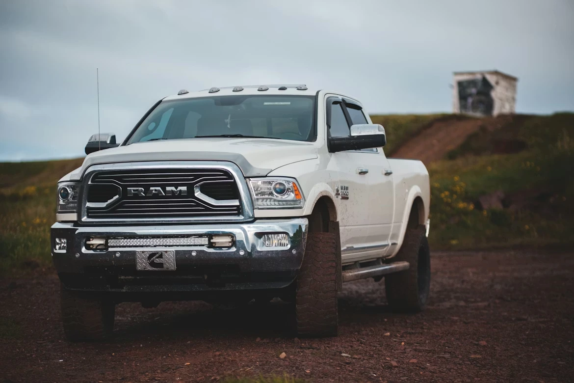 White Chevrolet single cab pickup truck on a road