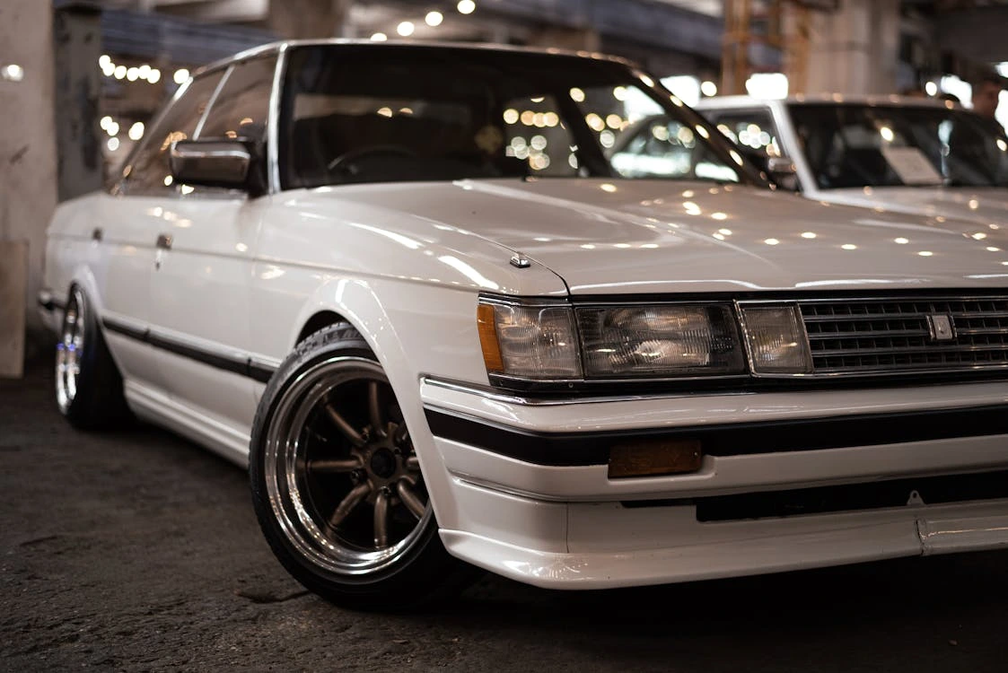 White shiny car parked on a show
