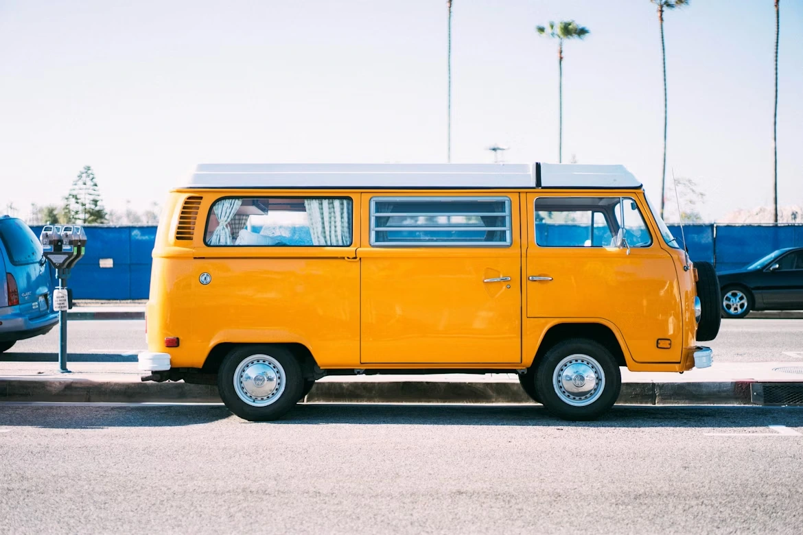 Yellow minivan on parking lot