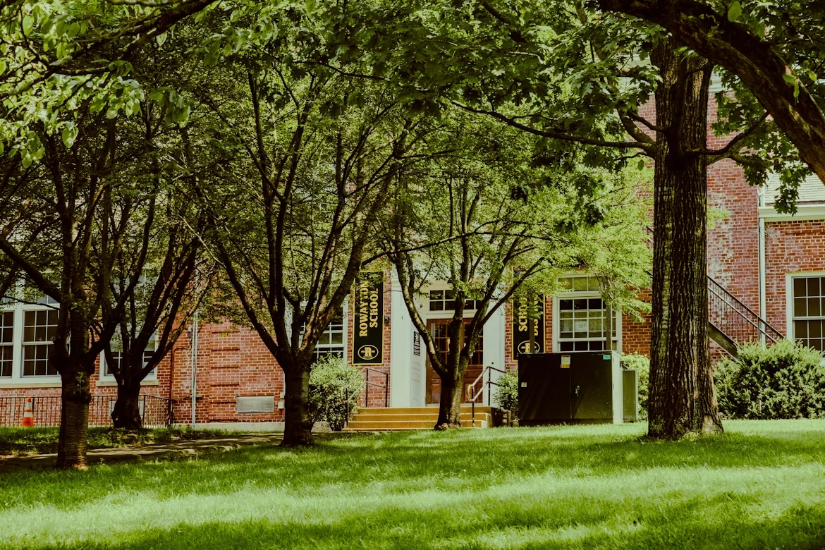 Brown and white house near green trees at Rowayton Elementary School in Norwalk, Connecticut